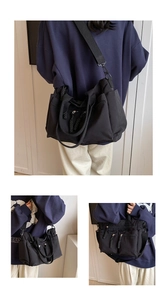 Multiple views of a black large capacity nylon tote bag with functional zipper pockets