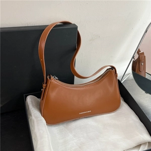 Chic caramel brown faux leather underarm shoulder bag with silver zipper and fashion logo