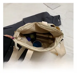 Detailed top view showing the spacious interior compartment of this large beige tote bag