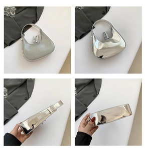 Detail view of silver metallic moon bag showing the polished mirror finish and glitter textures