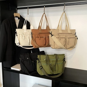 Large capacity nylon tote bags with double zipper pockets in five earthy tones and wide straps