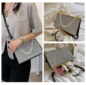 Detailed views of silver sequin evening bag showing pearl handle and interior capacity