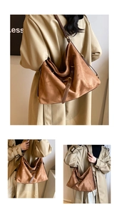 Close-up of brown suede tote bag featuring adjustable leather straps and metal buckles