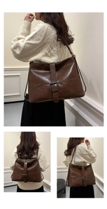 Detailed views of vintage brown leather tote bag with metallic buckle and strap design
