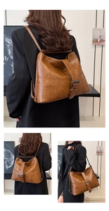 Detail of caramel brown faux leather backpack with metallic buckle and slim straps