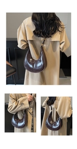 Detail of dark brown oil wax leather shoulder bag with vintage texture and gold hardware