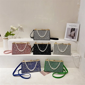 Elegant pearl handle evening bag with sparkling rhinestones in six colors on steps