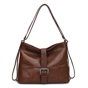 Retro dark brown leather shoulder bag with buckle closure and adjustable strap