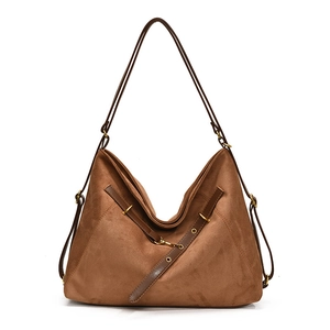 Brown vintage suede hobo shoulder bag with leather straps and adjustable gold buckles