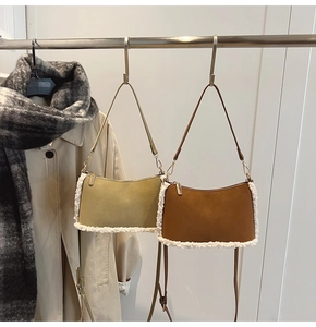 Detail showing the contrast of smooth leather and soft fleece stitching on winter bags