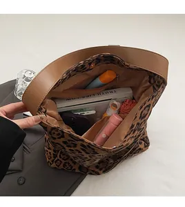 Interior view of leopard print tote bag showing spacious capacity for daily items
