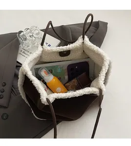 Top view of faux shearling tote bag interior showing large capacity and daily essentials
