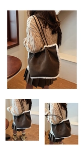 Detail showing the brown suede tote bag with white faux shearling trim and long straps
