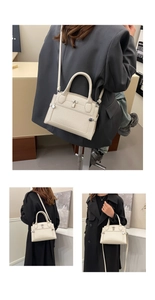 Detailed macro view of white textured leather handbag with silver metal padlock accent