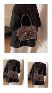 Detail of dark brown glossy leather handbag with bow accents and contrast stitching