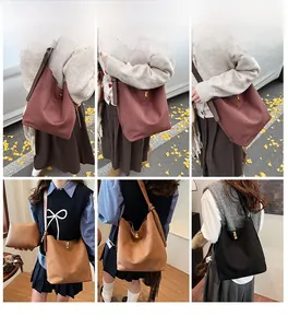 Detail shots of large suede bucket bags with gold locks in burgundy, brown, and black