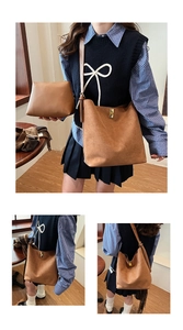 Detailed view of brown suede tote bag set with metal buckle and matching small pouch