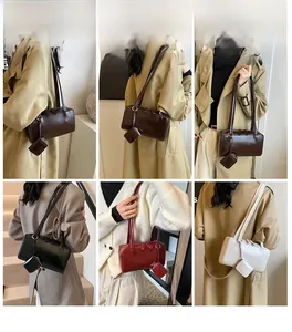 Detailed views of minimalist leather shoulder bags with detachable mini charm pouch