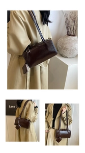 Detail of glossy dark brown rectangle tote bag with matching coin purse and slim strap