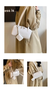 White rectangular underarm bag with a matching mini earphone case charm on a long strap
