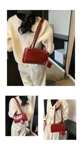 Detail of red vintage underarm bag with matching detachable zip pouch and dual straps