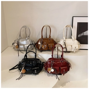 Detail view of stylish PU leather bowling bags in five colors with decorative charms