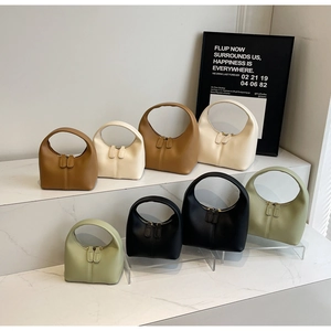 Detail view of mini hobo handbags in four colors showing dual zipper closure and smooth texture