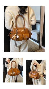 Detail of vintage brown shiny leather bowling bag with functional pockets and baseball charm