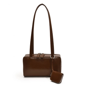 Caramel glossy leather tote bag with rectangular box shape and matching mini pouch accessory