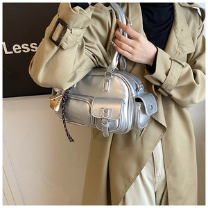 Detail showing metallic silver bowling bag with multiple functional exterior pockets