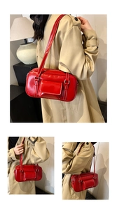 Detail of red leather shoulder bag featuring white contrast stitching and a front flap pocket