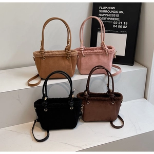 Detail showing four suede bucket bags with faux shearling trim in various colors