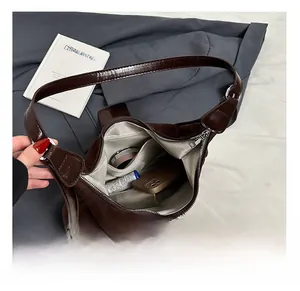 Top view of retro brown tote bag interior showing large capacity and inner pocket detail