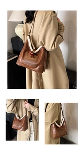 Close-up of brown faux leather shoulder bag with white faux shearling trim and toggle
