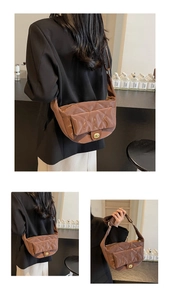 Macro detail of brown quilted saddle bag featuring glossy finish and gold twist lock