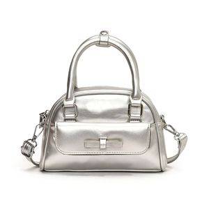Silver metallic shell handbag with bow decoration and detachable shoulder strap for women