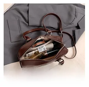 Internal view of brown retro bowling bag showing spacious capacity for cosmetics