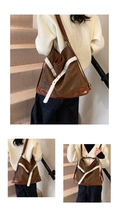 Detail of a large brown vintage shoulder bag featuring white faux fur trim and soft texture