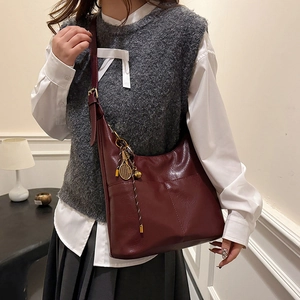 Large dark wine red hobo tote bag with tennis racket charm for stylish daily commuting