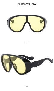 Détails de lunettes de soleil oversize noires avec verres jaunes, vue de face et profil