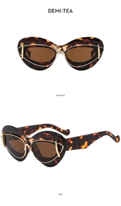Detail view of demi-tea cat-eye sunglasses with golden wire accent and side profile