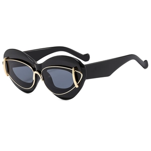 Chic black cat eye sunglasses for women with trendy gold metal accents and dark lenses