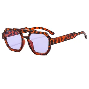 Classic double-bridge aviator sunglasses with tortoiseshell frames and purple lenses