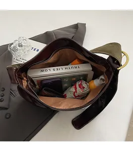 Macro view of large PU leather tote bag interior with multiple organizational pockets