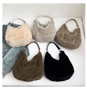 Detail shot of fluffy faux fur tote bags in five neutral colors with leather handles