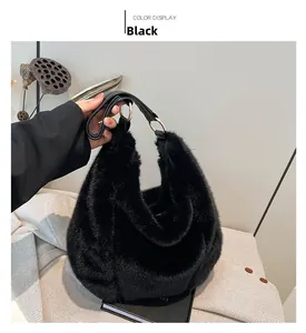 Detail of black faux fur tote bag with leather handle and metallic ring buckle design
