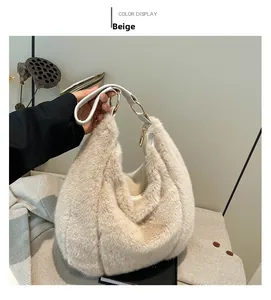 Detailed close-up of plush beige hobo bag featuring premium golden metal rings on handle