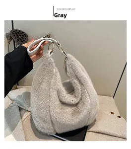 Detail of light grey faux fur tote bag with white leather handle and gold metal rings