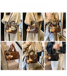 Retro Boston style handbag with bear charms shown in crossbody and shoulder carry views
