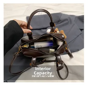 Detailed interior view of a vintage brown leather satchel with spacious storage space